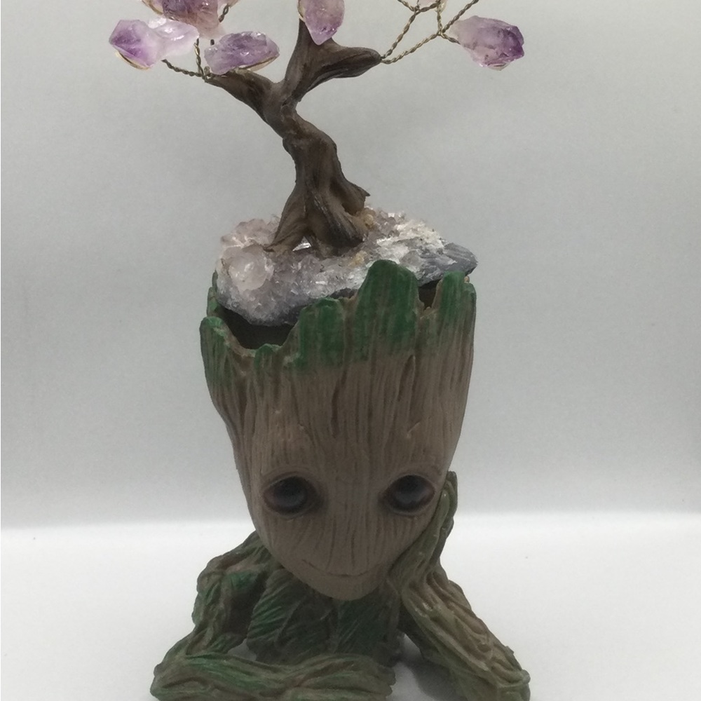 Groot planter one hand on chin